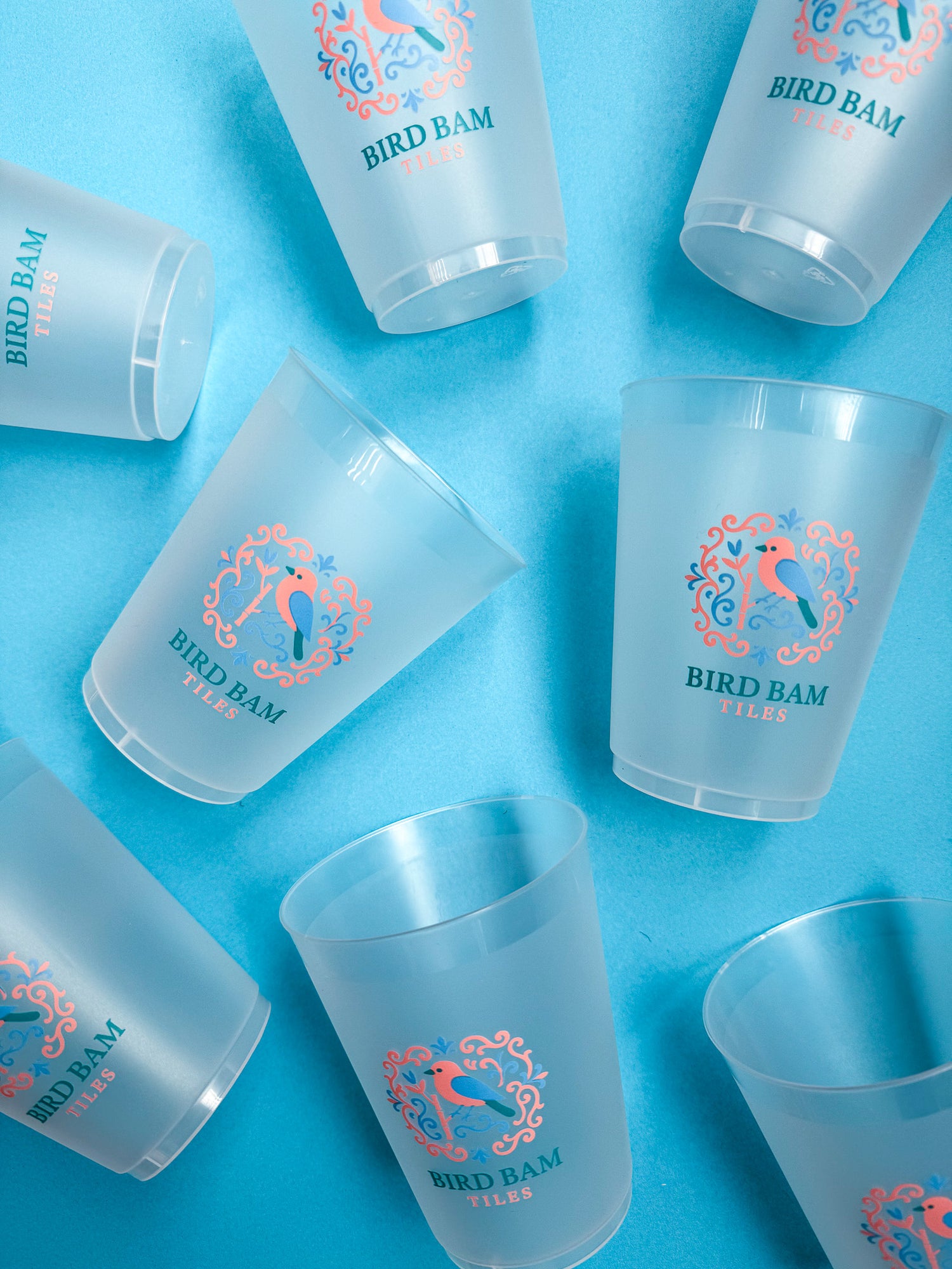 Bird Bam Tiles Reusable Cups on a Blue Background