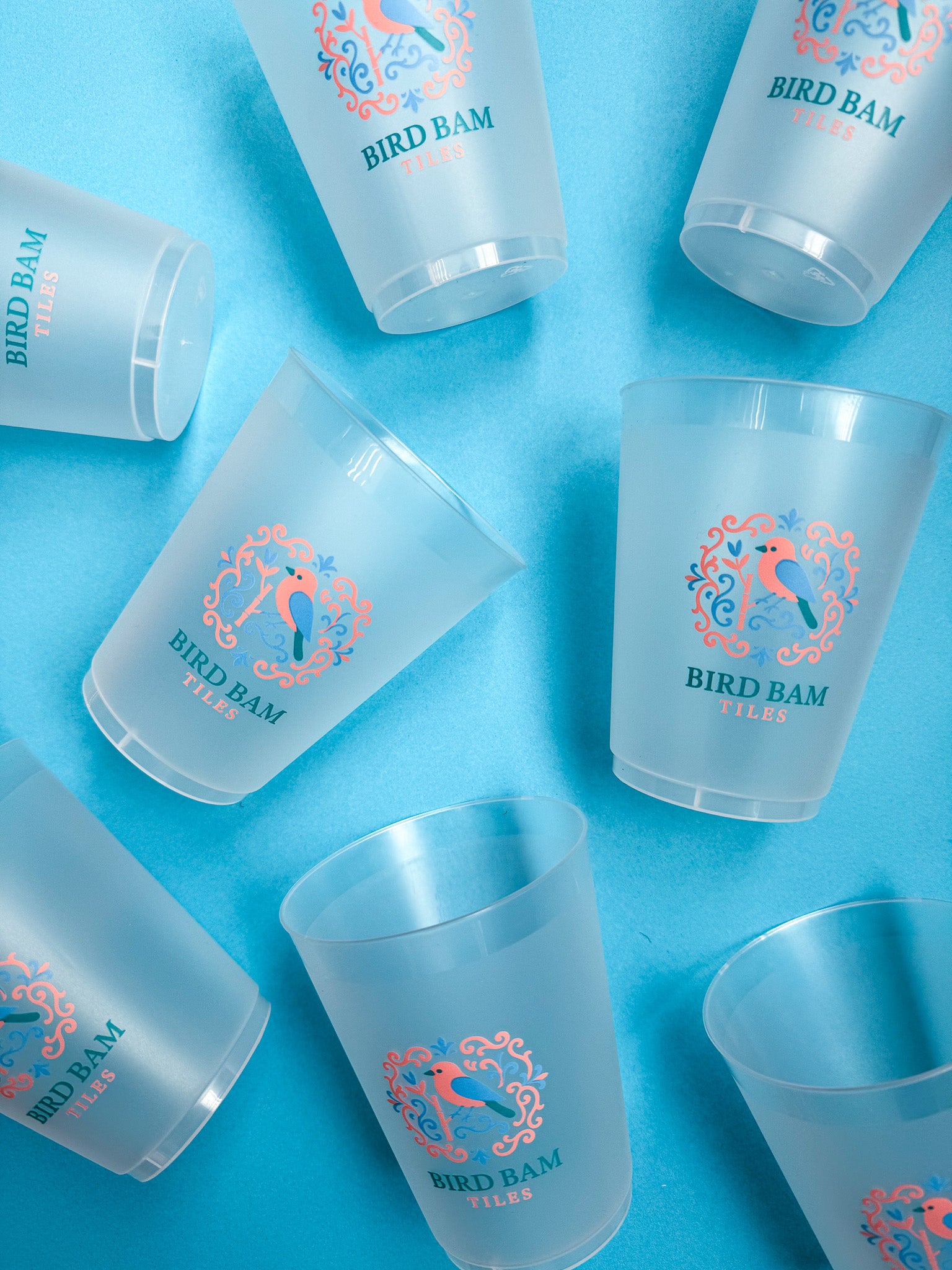 Bird Bam Tiles Reusable Cups on a Blue Background