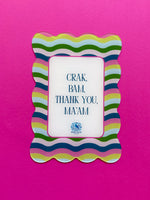 Colorful scalloped shuffler card featuring Crak Bam Thank You Maam text and pink, green, and blue squiggle lines on bright pink background
