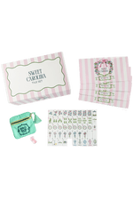 Sweet Carolina Mahjong Set featuring pink and white stripe box, four instructional cards, a mint green dice bag, and set of 160 tiles